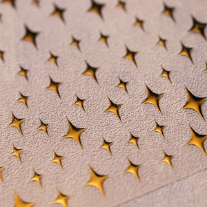 3D gold star nail art stickers with embossed star patterns and metallic gold finish