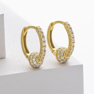 Macro shot of S925 sterling silver gold earrings with cubic zirconia spheres