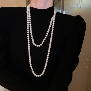 French vintage double-layered white glass pearl necklace shown on a model for an elegant look