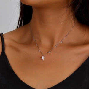 Elegant S925 sterling silver necklace with square zircon pendant worn by a female model