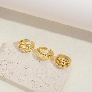 Three-piece set of 14K gold plated vintage rings with twisted and textured open designs