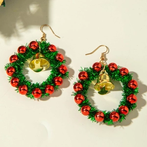 Detail of Christmas wreath earrings with green fur, red beads, and gold bells