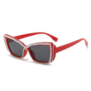 Luxury oversized cat-eye sunglasses with red crystal-studded frames and dark grey lenses