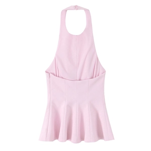 Detail of pink halter neck top featuring ruffled hem and side zipper closure