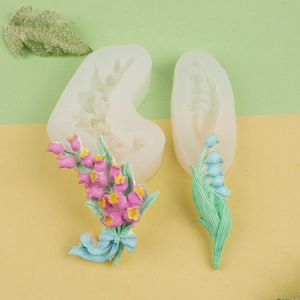 Detail view of silicone flower molds with 3D tulip and lily of the valley patterns