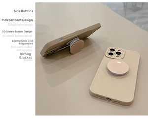 Detail view of beige matte iPhone case featuring an integrated circular airbag kickstand
