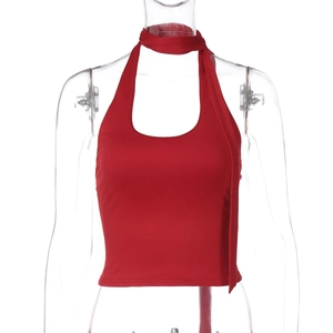 Close-up of a red halter neck slim fit crop top with flowing straps and stretchy fabric