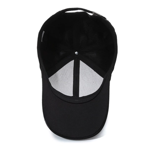 Internal view of black cotton baseball cap showing lining, sweatband, and metal buckle