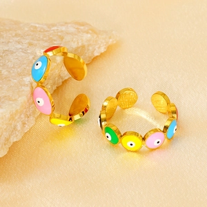 Gold-plated Turkish Evil Eye adjustable rings with colorful enamel on satin background