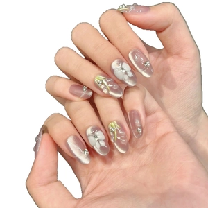 Handmade cat-eye purple press-on nails with 3D floral petals and delicate pearls