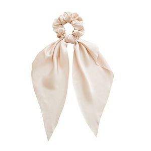 Champagne gold satin scrunchie with long ribbon bow showing silky texture on white background