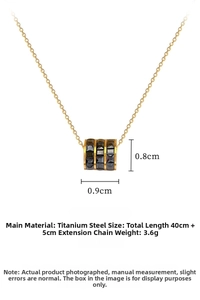 Macro view of cylinder pendant with black geometric texture on titanium steel chain