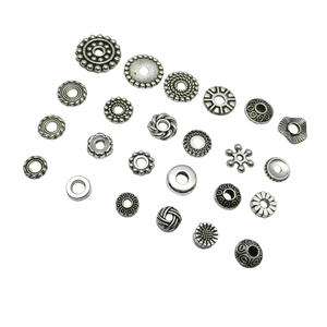 DIY jewelry making kit featuring assorted silver alloy spacers and charms on white background