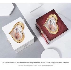 Classic heart-shaped music boxes in white lacquer and mahogany wood grain finishes