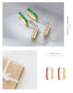 Detail of rectangular gold earrings with colorful baguette-cut green and pink stones