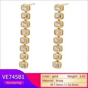 Long geometric drop earrings in 18K gold plated brass with clear rectangular zircon stones