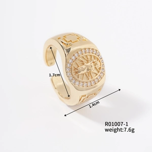 Gold religious medallion ring with embedded crystals and dimensional size markings