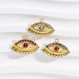 Three gold evil eye charms with colorful crystals for DIY jewelry making and crafts