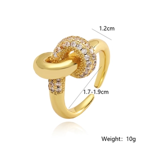 Detail of 18K gold plated geometric knot ring showing 1.2cm width and zircon accents
