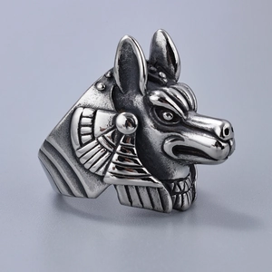 Macro view of vintage silver Anubis ring with detailed relief and punk style wolf head