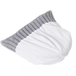 Detailed view of kids winter knit beanie with grey ribbed trim and white knit top