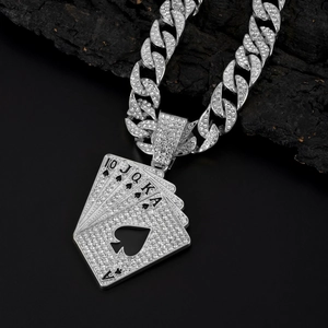 Close-up of hip hop silver Cuban chain necklace with iced-out poker cards pendant