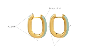 Detail of 2.3cm oval hoop earrings featuring gold plating and mint green enamel finish