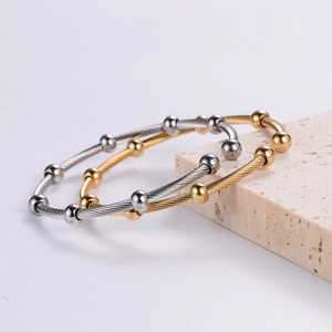 Minimalist twisted cable open bracelet with 6mm metal beads in silver and gold-tone finish