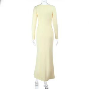 Detailed back view of the slim-fit pale yellow long dress with ruffled hem details