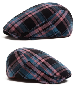 Close-up of the retro plaid pattern and woven cotton texture on the flat cap