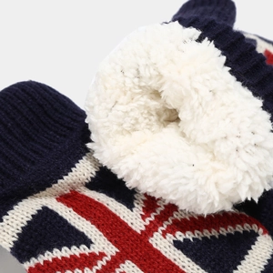Detail view of navy blue knitted glove with British flag pattern and thick white fleece lining