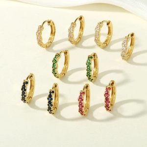 Minimalist 18K gold huggie earrings with colorful zircon stones in an array layout