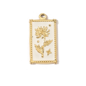 Detailed macro view of a gold square floral pendant with white enamel and star accents