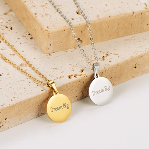 18k gold plated stainless steel necklace with round 'Dream Big' engraved coin pendant