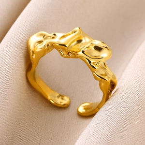 Detailed macro view of gold adjustable ring featuring irregular molten metal texture