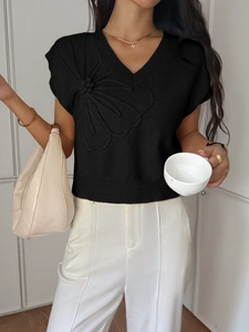 Women's black V-neck short sleeve knit sweater featuring a 3D floral accent on the front