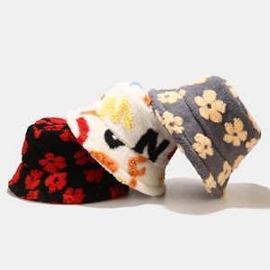 Plush lamb wool bucket hats with floral patterns in black, white, and grey for women