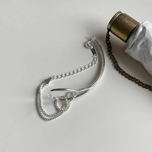 Detailed shot of S925 sterling silver knot bracelet showing fine metal stamp and texture
