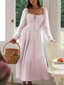 Elegant pale pink long sleeve maxi dress with square neckline and waist tie detail