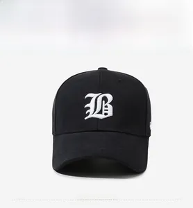Detailed view of white 3D embroidered B letter on a black cotton canvas baseball cap