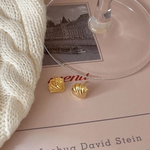 Elegant gold shell stud earrings in 925 sterling silver with a textured matte finish