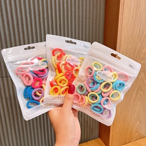 Colorful elastic hair bands for girls in macaron shades inside a clear zip bag