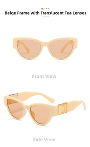 Detail of cream oval cat-eye sunglasses with tea lenses and golden metal accents