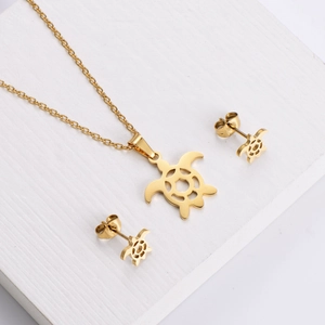 Golden stainless steel turtle jewelry set featuring hollow-out necklace and matching earrings
