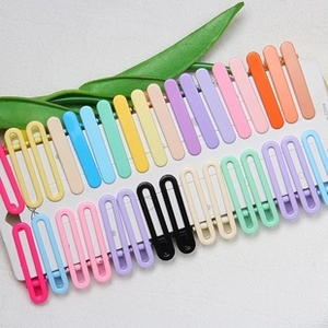 Detailed close-up of matte 6cm U-shaped colorful hair clips in various pastel shades