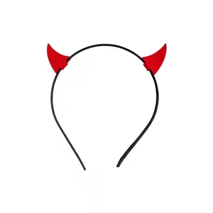 Detail of a Halloween devil horn headband featuring red glossy horns on a black band