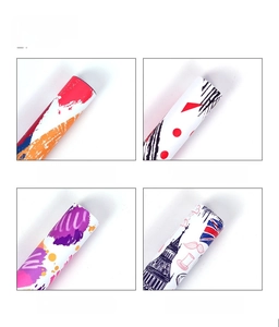 Detail show of gift wrapping paper featuring abstract, stripe, and Eiffel Tower designs