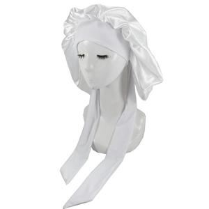 Detail of white satin sleep bonnet with adjustable wide straps for hair protection
