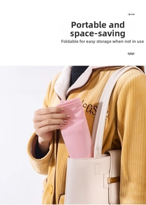 Pink portable travel shoe bag showing compact folding size inside a white shoulder handbag