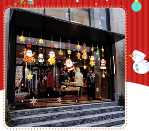 Detail of Santa Claus and snowman double-sided static stickers on a glass window